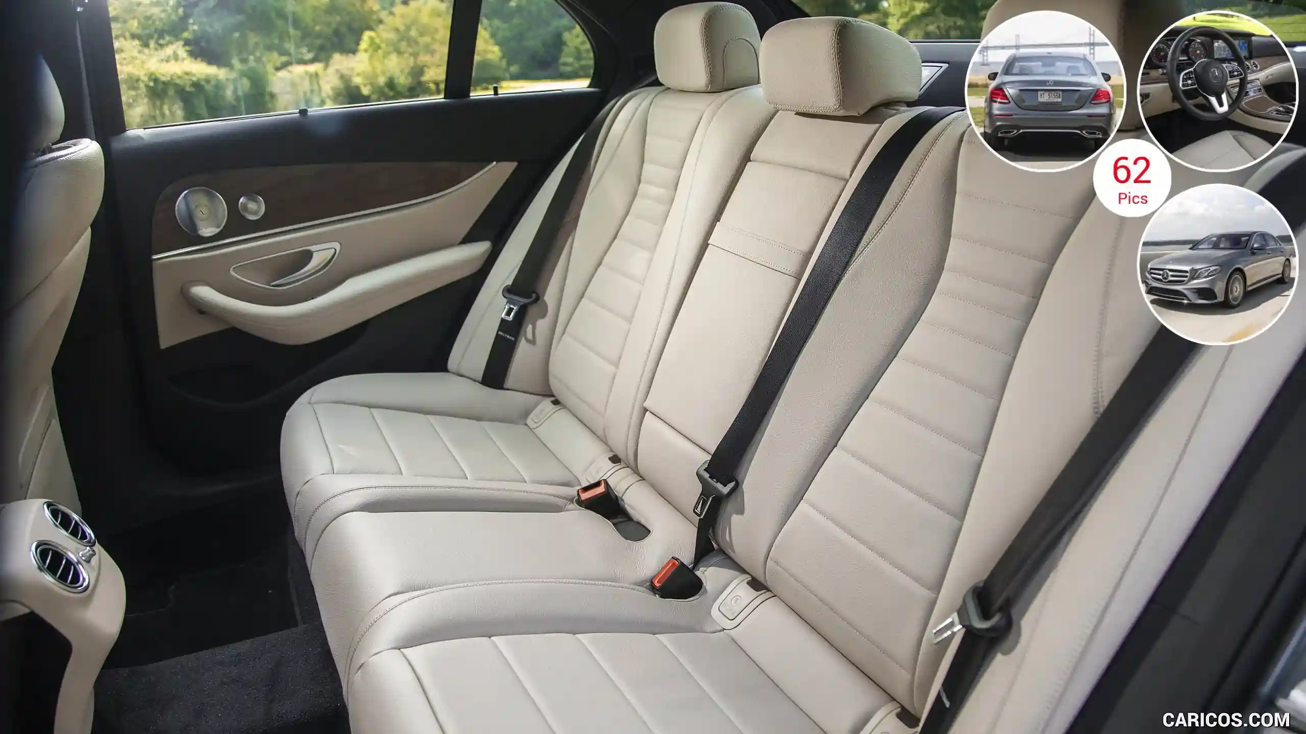 Luxurious beige leather backseat of a car, featuring three seatbelts, subtle wood accents, and a scenic view outside.