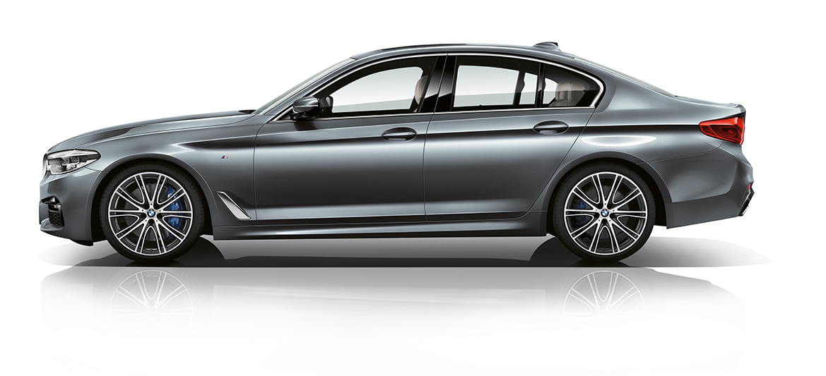 Sleek gray sedan displaying a modern design, featuring sporty alloy wheels and a polished finish against a white background.